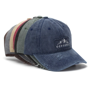 Side view of multi-color washed cotton baseball caps with distressed brim and embroidery