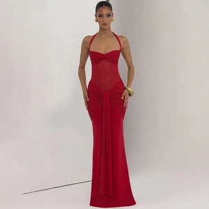 Detail of red ruched backless maxi dress with sheer mesh panels and halter neckline