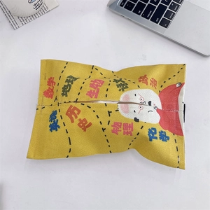 Close-up of yellow canvas car tissue box with school subject cartoon illustrations