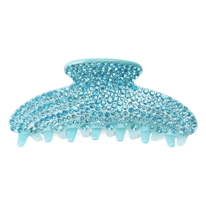 Close-up of light blue acrylic shark clip with sparkling rhinestone embellishments