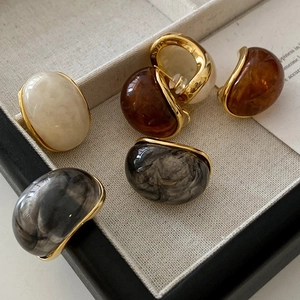 Retro resin oval stud earrings with 18k gold plating in ivory, amber, and marble grey