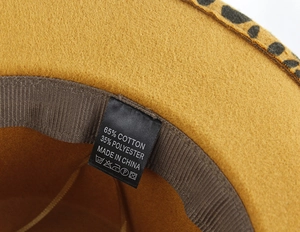 Detail of wool fedora inner lining showing 65% cotton and 35% polyester material label