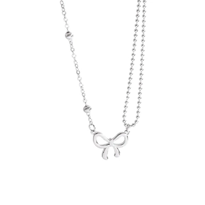 Minimalist titanium steel necklace featuring an asymmetric chain and hollow bow pendant