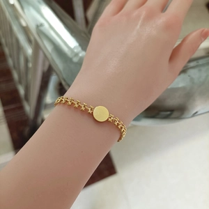 Exquisite 18K gold plated titanium steel chain bracelet with a round white shell pendant