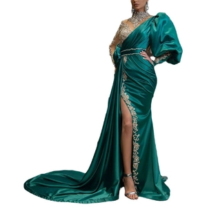 Elegant emerald green evening gown with silver sequins and asymmetric puff sleeves