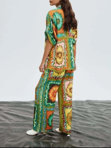 Rear view of fashion casual suit featuring vintage floral print and wide leg trousers