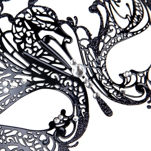 Detailed macro view of black butterfly masquerade mask with sparkling rhinestones