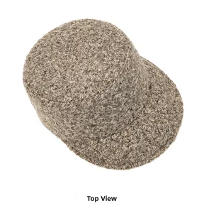 Top view of dark brown teddy wool baker boy hat showing thick curly texture