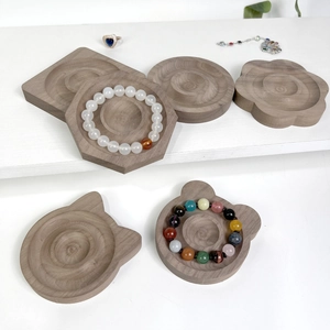 Collection of wooden jewelry display trays in walnut finish for rings and bracelets