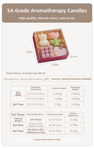 Detail view of scented candle gift set with bear, tulip and heart shapes in red box