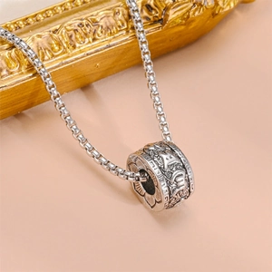 Polished silver titanium steel cylinder pendant necklace with detailed engraved patterns