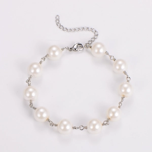 Detail view of handmade baroque pearl bracelet with silver lobster clasp and extension chain
