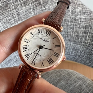 Elegant ladies quartz watch with rose gold case, white Roman dial and brown leather strap