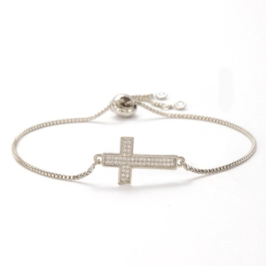 Detail of cross bracelet showing micro-pave zircons and adjustable box chain