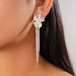 Elegant 18k gold plated flower stud earrings with shimmering pearl and long silver tassels