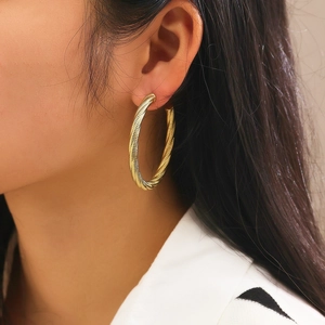 Golden twisted mesh texture hoop earrings made of stainless steel for women fashion