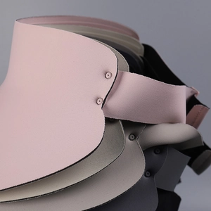 Detail of stacked sun visors showing premium matte fabric and durable rivet reinforcement