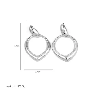 Detailed view of silver irregular teardrop earrings with dimensions 5.9cm by 3.7cm
