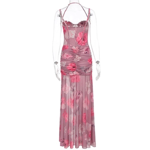Detail of ruched mesh long dress featuring pink floral prints and halter backless design