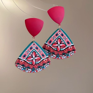Detailed close-up of Bohemian triangle pendant earrings with colorful floral geometric patterns