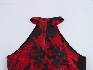 Detail of red and black floral jacquard halter neckline with discrete back zipper