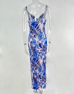 Detailed view of blue floral print and pleated texture on a slim fit maxi dress