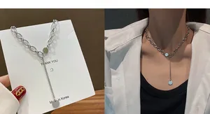 Detailed Y-shaped silver hip-hop necklace with oval links and a round pendant tag