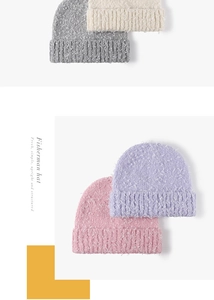 Detail of plush ribbed knit beanies in grey, beige, purple, and pink colors