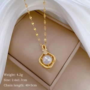 Detailed view of hollow gold teddy bear necklace with pearl and zircon inlay on silk