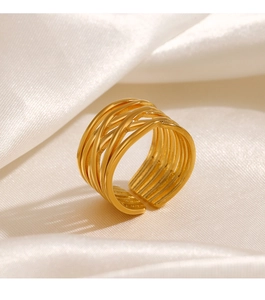 Detailed view of layered crossover hollow ring with 18K gold plating on silk background