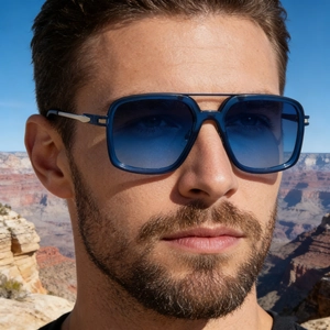 Close-up of square sunglasses with blue gradient lenses and silver metal temple detail