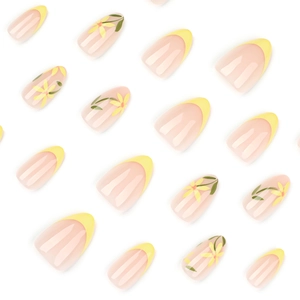 Faux ongles amande jaunes français avec motifs floraux minimalistes et pointes