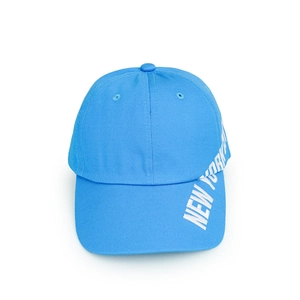 Detail view of sky blue baseball cap with white New York text on cotton twill fabric