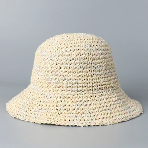 Detailed view of hand-woven summer straw sun hat with colorful mixed yarn accents