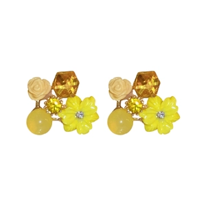 Elegant floral stud earrings with yellow cat eye stone and crystals on white background