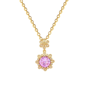 Elegant gold flower necklace with pink gemstone and crystals on a polished O-chain