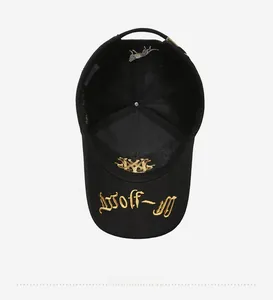 Detail of black baseball cap interior with gold Wolf-M embroidery and breathable mesh lining