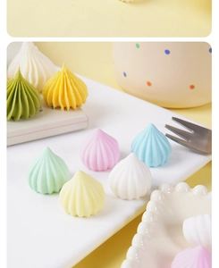Macro detail of colorful spiral meringue tower charms for DIY crafts and decorations