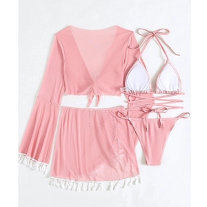 Flat lay of pink four-piece bikini set with sheer mesh cover-up and white fringe trim