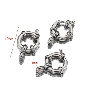 Macro detail of 19mm stainless steel spring ring clasp with 3mm connector and mirror reflection