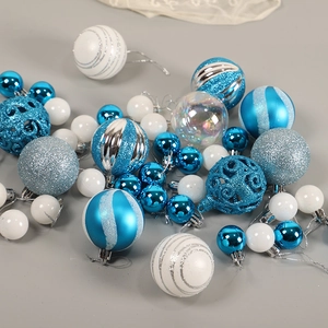 Assorted blue and silver Christmas tree ornaments with glitter and matte finishes