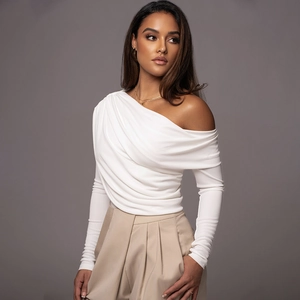 Detail of off-shoulder white long sleeve bodysuit featuring elegant pleated textures and slim fit