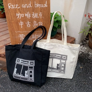 Japanese style canvas tote bag with bookshop print in black and beige colors