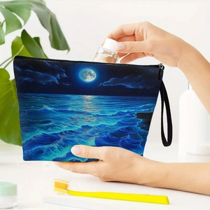Toiletry bag with ocean and moon print, zipper closure and canvas handle for travel