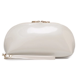 Cream shell-shaped faux leather makeup bag with gold zipper and wrist strap in studio shot