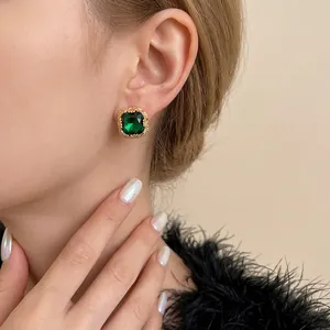 Retro luxury gold plated earrings with round green zircon and textured metallic frames
