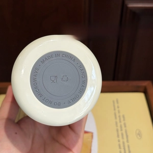 Detail view of the non-slip silicone base on this cream insulated stainless steel water bottle