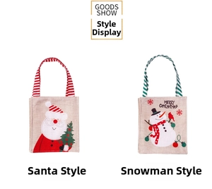 Detailed view of linen Christmas gift bags with Santa and Snowman prints and striped handles