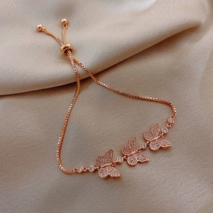 Detail of rose gold butterfly bracelet with rhinestones and adjustable slider clasp
