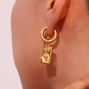 Artistic gold-plated stainless steel hoop earrings featuring female torso body pendants